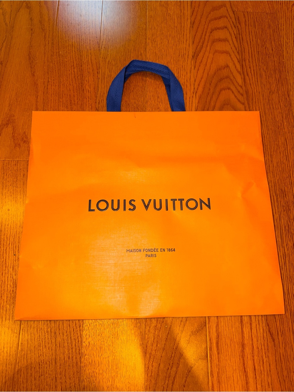 Louis Vuitton Bright Orange Tote with Deep Blue Handles.